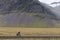 Touring cyclist are bicycling in Iceland at summer season