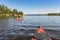 Touring kayakering in the shallow Enan river JÃ¤mtland Sweden