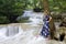 Touris stand look waterfall  at Erawan Waterfall and  natural