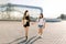 Tourism, adventures and friendship concept. Summer portrait of two cheerful asian girls, walking together on the airport