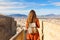 Tourism in Alicante, Spain. Back view of traveler girl walking on Santa Barbara castle enjoying view of Alicante city, Spain.