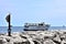 A tourism boat cruises the Lake Michigan shoreline