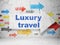 Tourism concept: arrow with Luxury Travel on grunge wall background