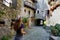 Tourism in Lombardy, Italy. Back view of beautiful girl visiting Sondrio old town, Valtellina, Italy