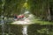 Tourism motorboat in cajuput forest in floating water season in Mekong Delta, Can Tho, Vietnam