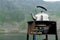 Tourism, an old kettle is heated on a rusty gas burner