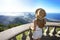 Tourism in Rio de Janeiro, Brazil. Young female tourist on Corcovado mountain looks Guanabara Bay. Beautiful girl on Christ the
