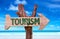 Tourism sign with a beach on background