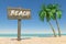 Tourism and Travel Concept. Wooden Direction Signbard with Beach Sign in Tropical Paradise Beach with White Sand and Coconut Palm