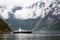 Tourism vacation and travel. Small yacht with mountains and fjord NÃ¦rÃ¸yfjord in Gudvangen, Norway, Scandinavia