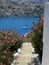 Tourism - View of the bay of mediterranian island. Sstairs down to the water.