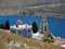Tourism - View of the bay of mediterranian island. View of church.