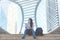 Tourism woman sitting and check map on staircase in city town, urban background, street style, happy and enjoy.