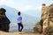 A tourist admires the beautiful landscape of Meteora, Greece with its monasteries, its mountains and its nature