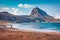 Tourist admires the sea view. Amazing spring scene of Monte Cofano National Park, Sicily, San Vito cape, Italy, Europe. Mediterran