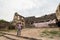 A tourist at the architectural ruins of the ancient Golconda Fort in the outskirts