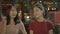 Tourist Asian sister hipster girls traveling and walking on street night in Bangkok, Thailand. Young student women feeling happy