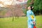 Tourist asian woman viewing flower trees