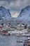 Tourist Attraction Hamnoy Fishing Village at Lofoten Islands in Norway Along With Red Rorbu Houses with High Snowy Mountains on