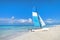 Tourist attractions on the Caribbean coast. Sailboat on the background of clear turquoise water in the sea and sky