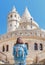 tourist with backpack admires a splendid view of the fisherman bastion, that is one of the most popular attraction in