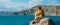 Tourist with a backpack against the sea, panorama. Portrait of a woman in tourist gear against the sea.