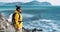Tourist with a backpack against the sea, panorama. Portrait of a woman in tourist gear against the sea. Travel and active