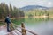 Tourist with backpack near a beautiful lake