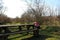 Tourist backpack on a wooden bench in the park