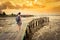 Tourist with backpack at Yeoh jetty, Georgetown, Penang, Malaysia