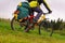 Tourist bike riding through the field, closeup