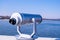 Tourist binoculars. Binocular telescope on the observation deck for tourism. Sea background. Sopot on the pier