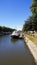 Tourist boat anchored on a harbor in the Bruges channel