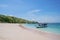 Tourist boat anchored on the pink beach