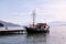 Tourist boat cruiser in small marina on sea and beautiful beach, waiting tourists for ship is sailing out of port for tourist tour