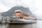 Tourist boat docking at Milford Sound passenger terminal pier