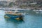 Tourist boat exiting Mgarr Harbor Gozo