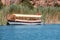 tourist boat ferry is waiting for tourists for a sightseeing tour and a tour of the Dalyan river Delta in Turkey. Birdwatching