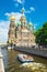 Tourist boat floats past the Church in St Petersburg