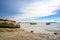 A tourist boat is moored in the water by the beach at Tup Kaek, Krabi, Thailand