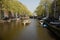 Tourist boat moves through a canal in Amsterdam