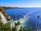 Tourist boat near Duden waterfall on the background of Lara beach in Antalya, Turkey. Beautiful Mediterranean seascape, tourist