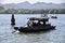 Tourist Boat near a Floating Stone Pagoda on The West Lake. Hangzhou, Zhejiang, China. October 28, 2018.