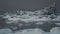 Tourist boat profile sailing near huge glacier in Jokulsarlon