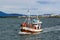 Tourist boat returning from Puffin Watching Tour in Reykjavik harbor