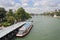 Tourist boat on the river Seine near pont Neuf