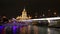 Tourist boat sailing on the Moscow river in the evening on a background of Novoarbatsky bridge and the hotel Ukraine