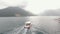 A tourist boat sails along the Bay of Kotor near Perast