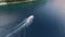 Tourist boat sails along Kotor Bay along Perast embankment