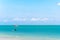 A tourist boat sails away on the beach of Joao Pessoa